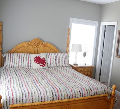 First floor master bedroom with a king size bed