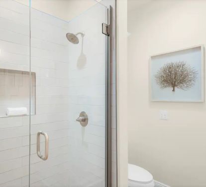 Shipwatch-17 Bedroom 1 private full bath. Photo 2. Quartz vanity and fameless glass, tiled shower.