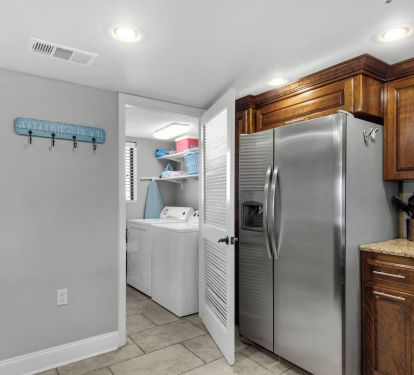 Laundry room with full size washer and dryer