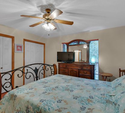 Third bedroom with Queen bed and TV and double closet.