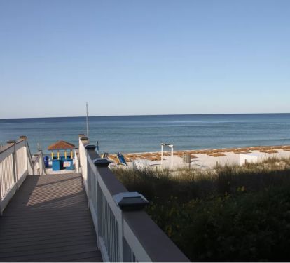 Walkway from pool deck to the beach.  Chair &amp; Umbrella service incl. in season.