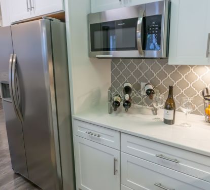 enjoy a drink in the brand new kitchen with custom cabinetry