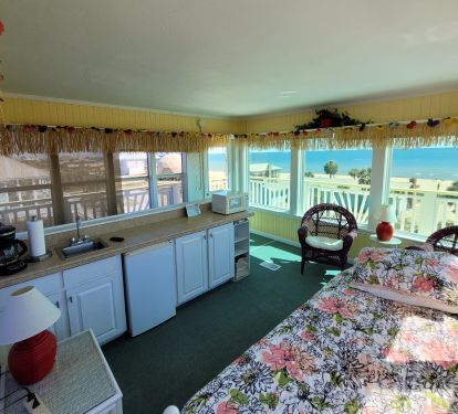 Aloha room with trundle bed, coffee maker, mini fridge, microwave, tv, window ac