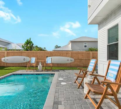 Bliss-3 Don't want to spend your family vacation with strangers at a community pool? We get it. Bliss offers a (seasonally heated) private pool in a fenced back yard complete with paddleboards and propane grill.