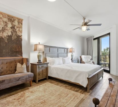 Huge master bedroom with king bed and private deck access.