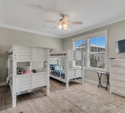 Main Floor 4 Bunk Room.  Child's pack and play and a highchair in Closet!