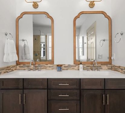 Top-floor Primary King Suite private bath has double vanities so no one waits their turn in the morning