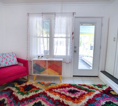Side entry in to laundry room and seating area. 