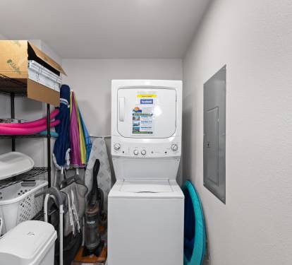 Full size laundry room with high chair and pack-n-play for guest use