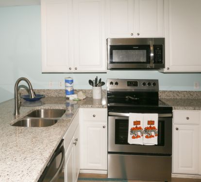 kitchen with all stainless and granite