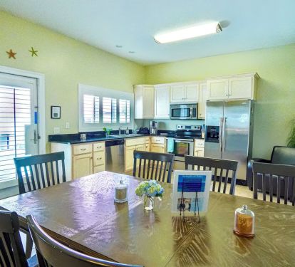 Fully equipped kitchen and dining area on the first floor