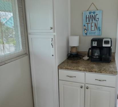 Coffee bar and pantry. Keurig K-duo coffee maker with both pot and k-cup brewing