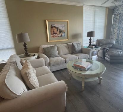 (new neutral curtains -not shown ) both windows open up to side view of beach as well as full beach from balcony