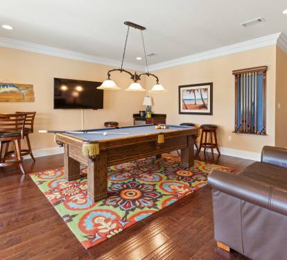 Billiards room with floor to ceiling windows and 2nd floor patio