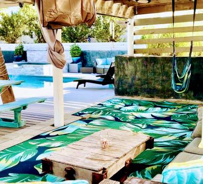 Outdoor Covered Pergola with Plenty of seating to Watch the Game or a Movie