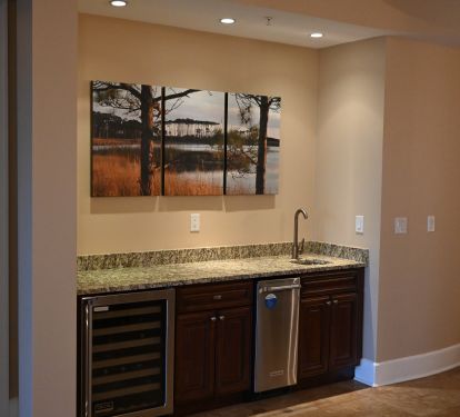 Wet Bar With Ice Machine And Wine Refrigerator.