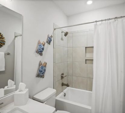 Main Floor Guest Bathroom with Tub and Shower
