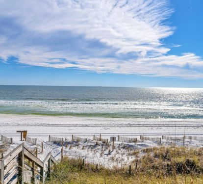 You are steps away from white sand and blue water!