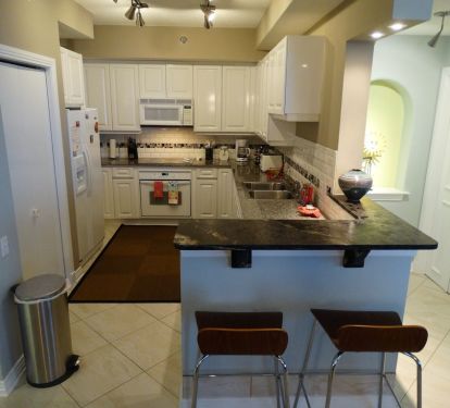 Kitchen is Outfitted with Granite Counter tops and a full set of Appliances 