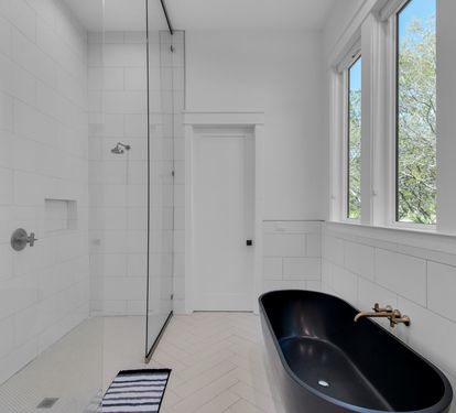 Double shower heads in walking shower