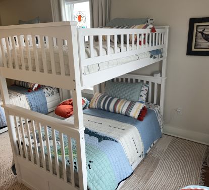 Boys' bunk room includes two trundles for little ones