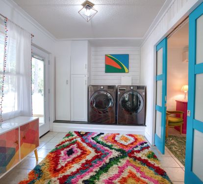 Laundry and Seating area. Blue doors lead in to the Suite Palm King Bedroom.