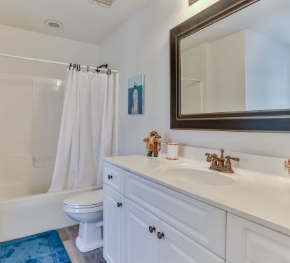 1st floor ensuite bath with door to pool.