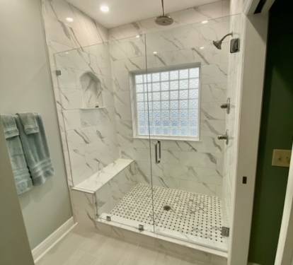 custom shower with rain shower head in main floor master
