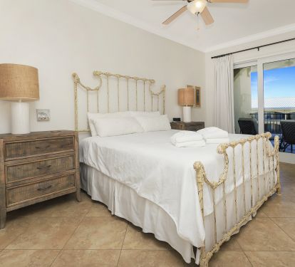 Master BR with king bed sliding glass door to balcony overlooking 3 tiered pool!