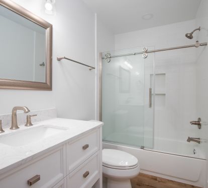 Full bathroom with tub, accessed via hallway, just outside BR 2.