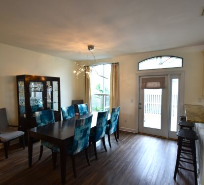 Dining table with seating for 8 &amp; additional bar seating overlooking the kitchen