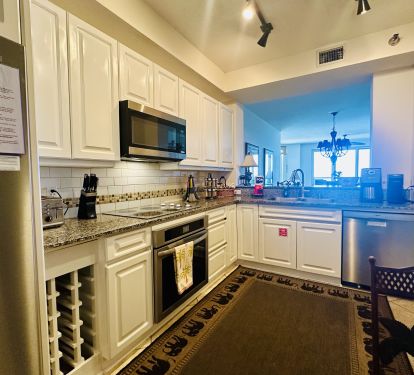 Kitchen is outfitted with granite countertops and a full set of appliances