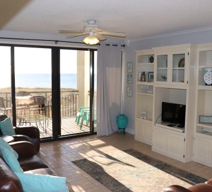 Living Room with Balcony Access and view of Gulf