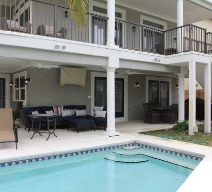 Pool area, group seating, TV, Kitchenaid outdoor grill center, 2 seated dining areas