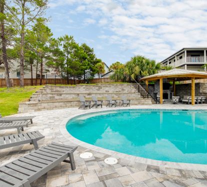 Pool can be optionally heated. Outdoor fireplace and stairs to putting green.