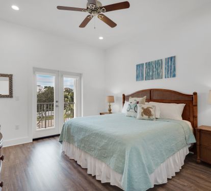 King Bedroom with private bathroom and access to deck overlooking front