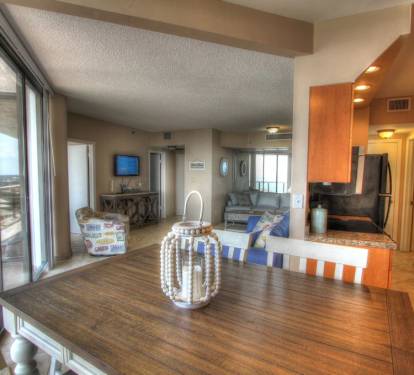 view from dining area into living room/kitchen