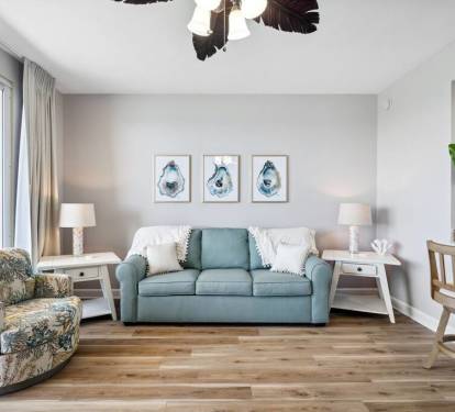 Living Room: Bright and airy space with stylish seating and beachy d&eacute;cor, perfect for relaxation!
