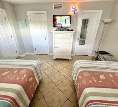 Spacious Guest Bedroom with Two Queen Size Beds, Bath Access, &amp; Walk in Closet.