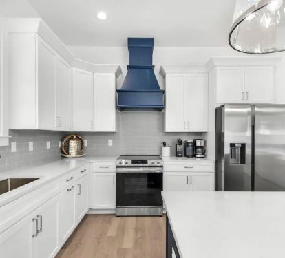 Vista-12 Create your culinary masterpieces in Vista's new kitchen, featuring stainless appliances with quartz counters.