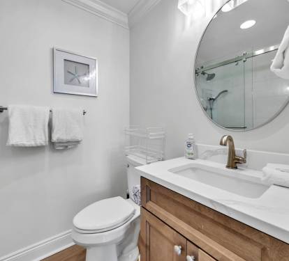Newly renovated bathroom offers private access from guest bedroom.