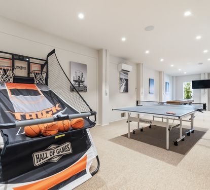 Your private game room awaits with a basketball arcade, table tennis, and treadmill&mdash;perfect for friendly competition or staying active during your stay.