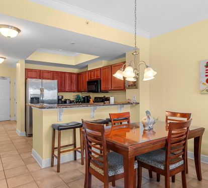 Dining table and kitchen.