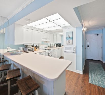 Enter into the kitchen area, perfect to drop off the groceries as you arrive. 