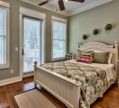 Downstairs bedroom with private bath/shower viewed from entry door.