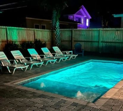 Enjoy a movie by the pool or the tranquil rippling from the pool's water features while under the starlight. 