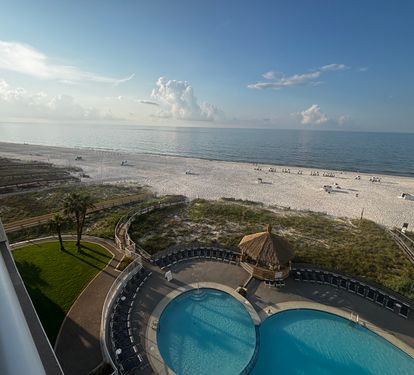 View out to the balcony &amp; beach. Chairs &amp; umbrella service available.
