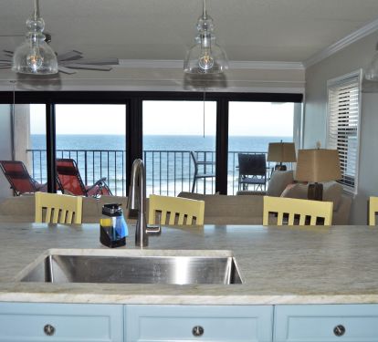 Gulf view from kitchen, new quartzite countertop &amp; pendants.