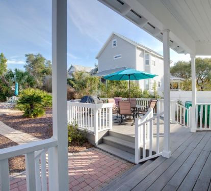 Deck overlooks the pool and backyard.