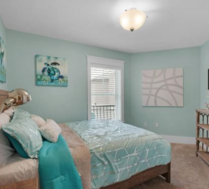 Shenanigans-18..2nd floor private queen room. All bedrooms have wall-mounted flatscreens with every channel imaginable.